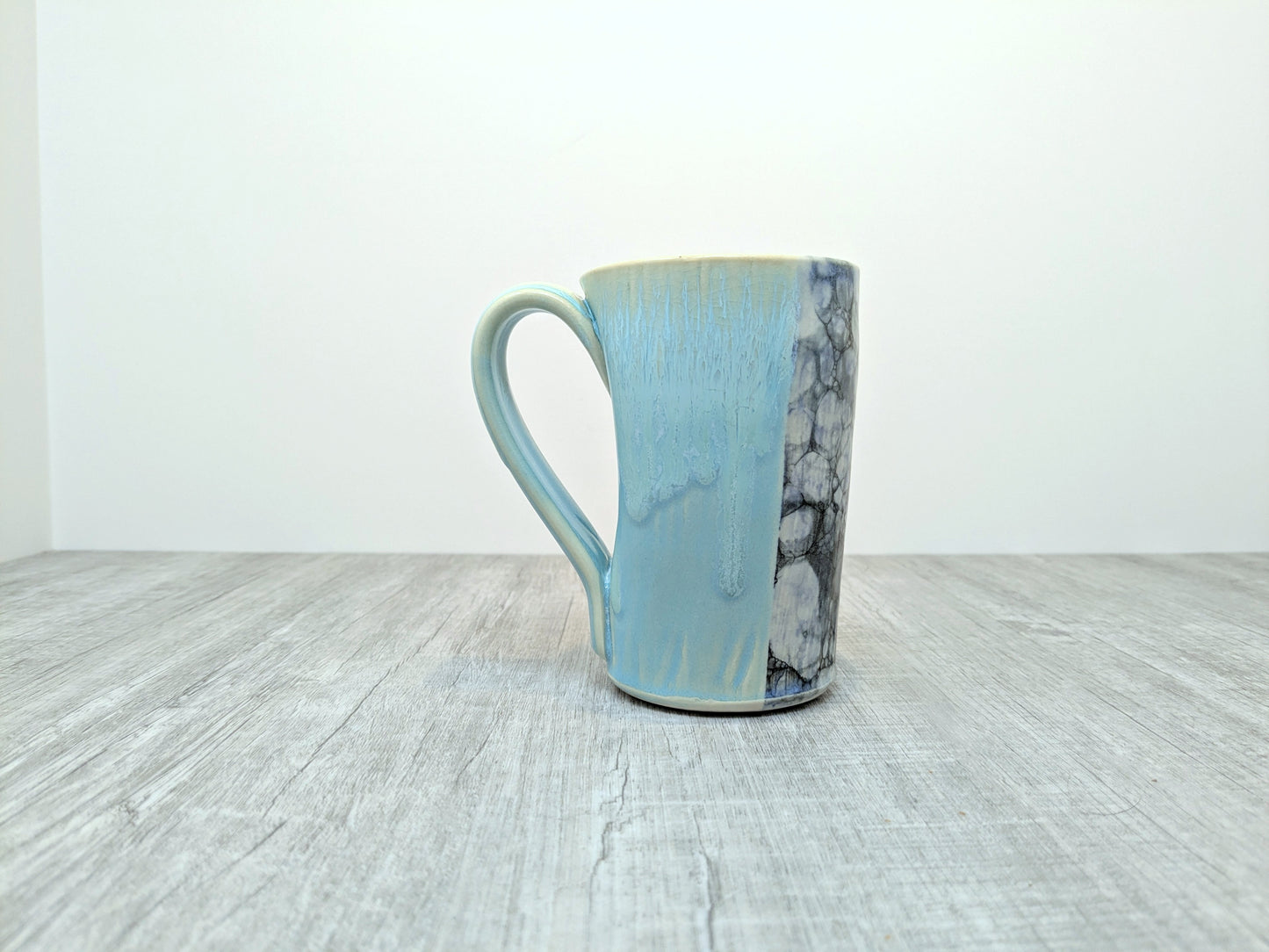 Blue Drip Glaze Pottery Mug with Abstract Pebble Design
