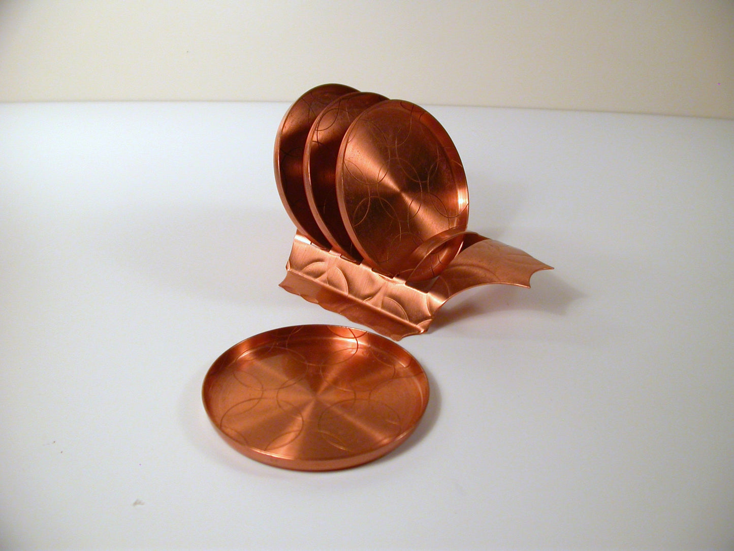 Mid Century copper coaster set, made by Fantasy Copperware.