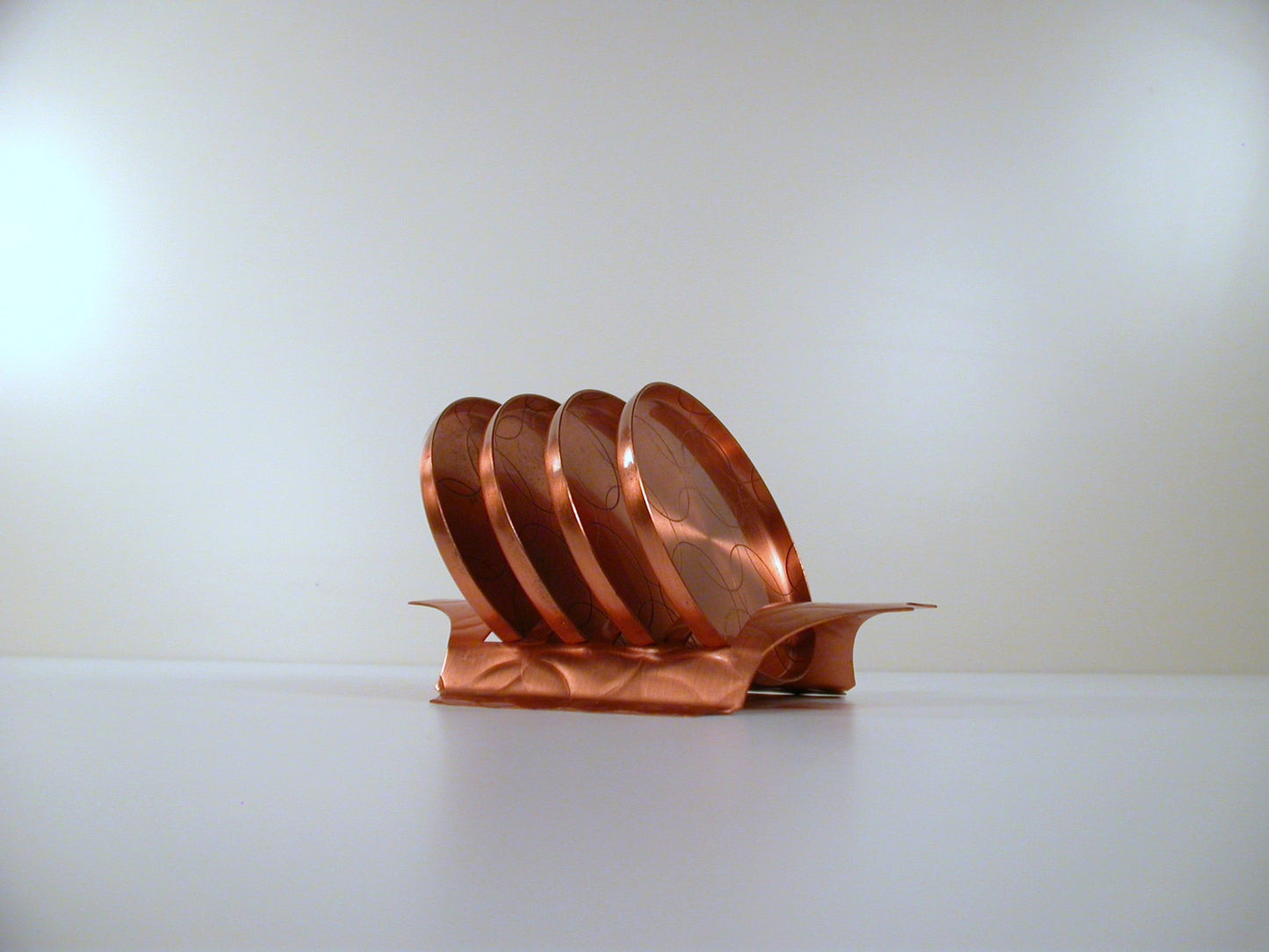 Mid Century copper coaster set, made by Fantasy Copperware.